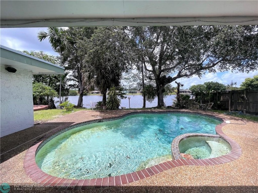Desirable 3 bed, 2 bath pool home on a wide lakefront lot in - Beach Home for sale in Sunrise, Florida on Beachhouse.com