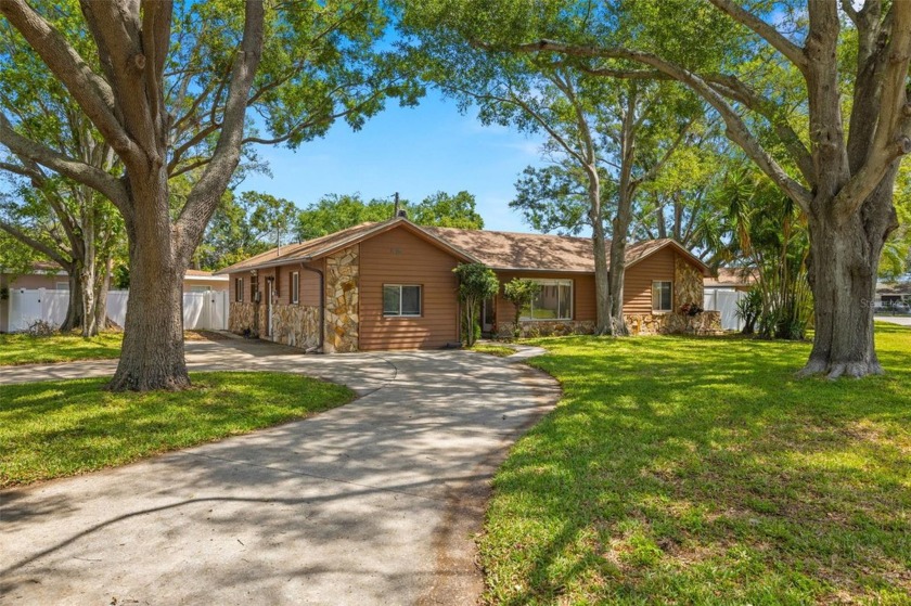 This spacious home with circle drive and fenced yard has plenty - Beach Home for sale in Largo, Florida on Beachhouse.com