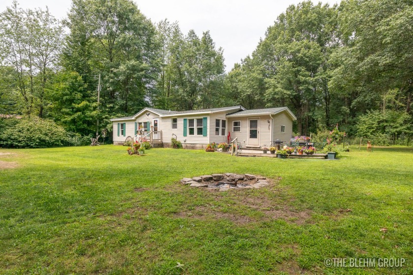 Experience the charm of this delightful 4-bedroom, 2-bathroom - Beach Home for sale in West Olive, Michigan on Beachhouse.com