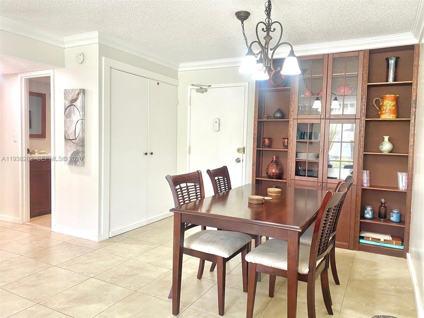 LIVE ACROSS FROM THE BEACH! This fully furnished 1 bedroom + den - Beach Condo for sale in Sunny Isles Beach, Florida on Beachhouse.com