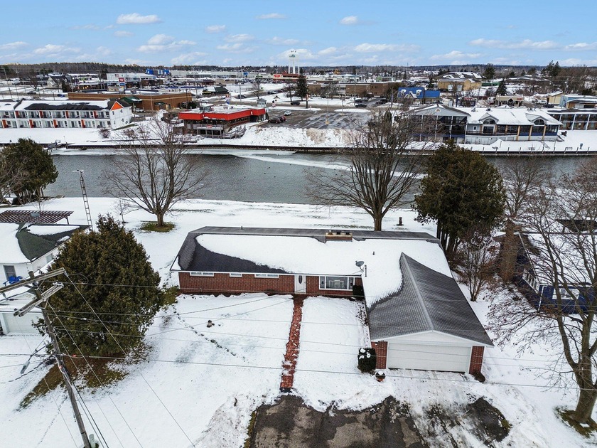 Set along Northern Michigan's iconic inland waterway on the - Beach Home for sale in Cheboygan, Michigan on Beachhouse.com