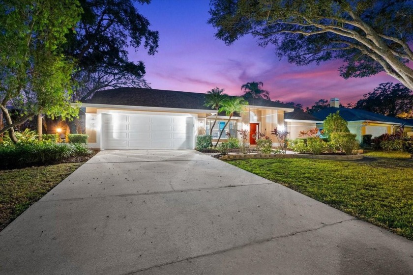 This stunning 2,457 sq.ft. pool home with an oversized two-car - Beach Home for sale in Palm Harbor, Florida on Beachhouse.com