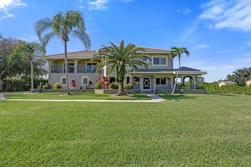Stunning 5BD/3BA estate on 1.25-acre fenced lot in sought-after - Beach Home for sale in Davie, Florida on Beachhouse.com