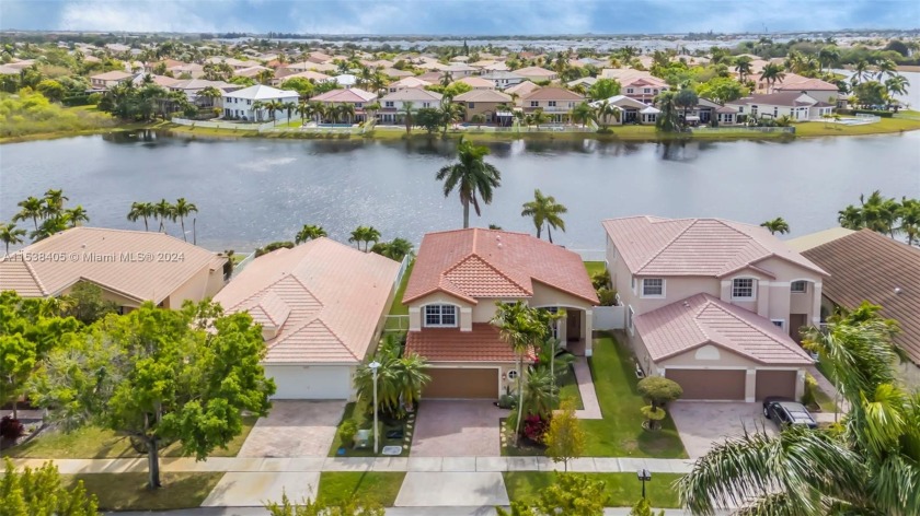 Gorgeous two story home on the lake with a pool, with four - Beach Home for sale in Miramar, Florida on Beachhouse.com