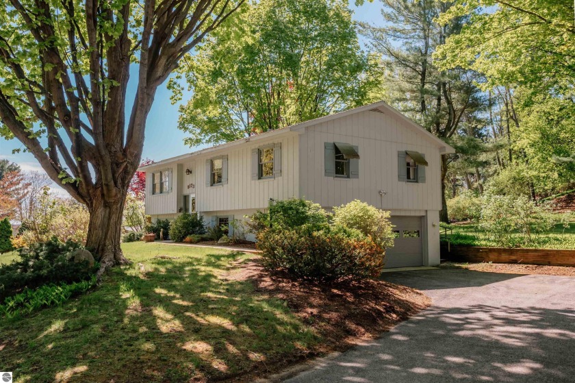 Nestled near the base of Old Mission Peninsula, this 3-bedroom - Beach Home for sale in Traverse City, Michigan on Beachhouse.com