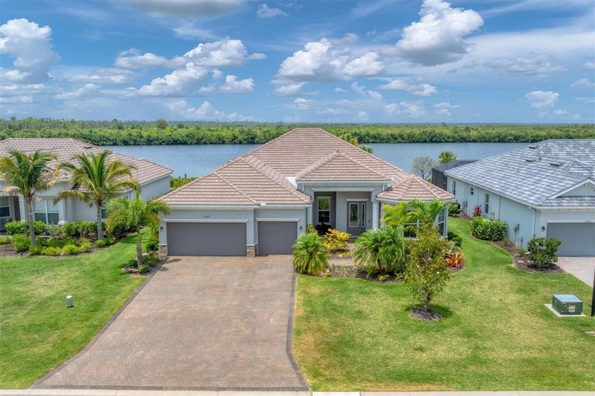 Experience exclusive waterfront living at Harbor West, a serene - Beach Home for sale in Port Charlotte, Florida on Beachhouse.com