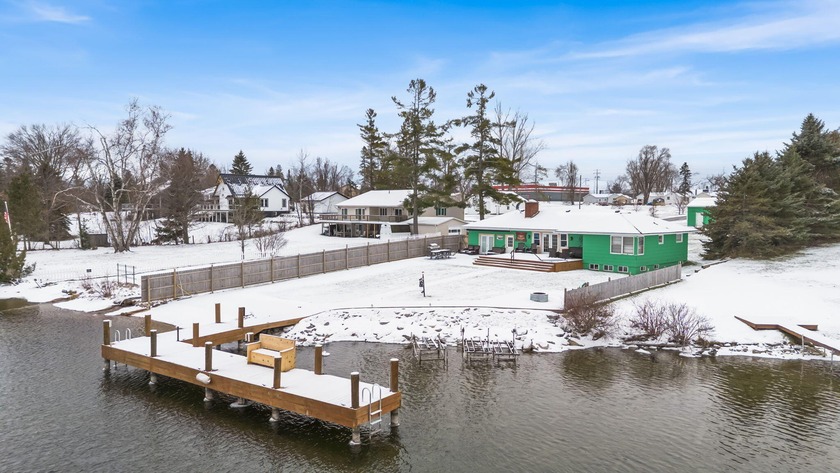 CHEBOYGAN RIVER - WATERFRONT HOME This classic ranch-style - Beach Home for sale in Cheboygan, Michigan on Beachhouse.com