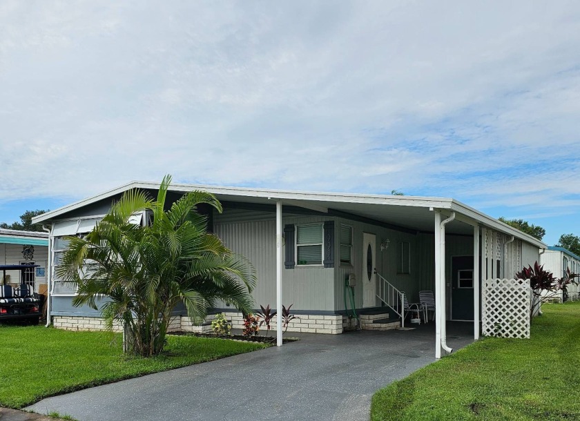 Located in the peaceful Village Green, this lovely home is - Beach Home for sale in Vero Beach, Florida on Beachhouse.com