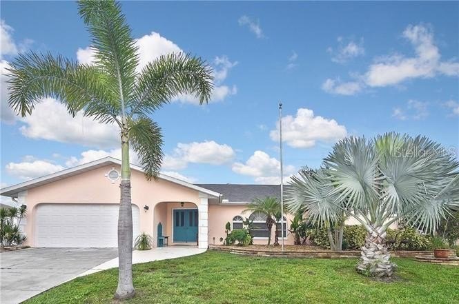 This inviting pool home boasts a spacious open floor plan, ideal - Beach Home for sale in Port Charlotte, Florida on Beachhouse.com