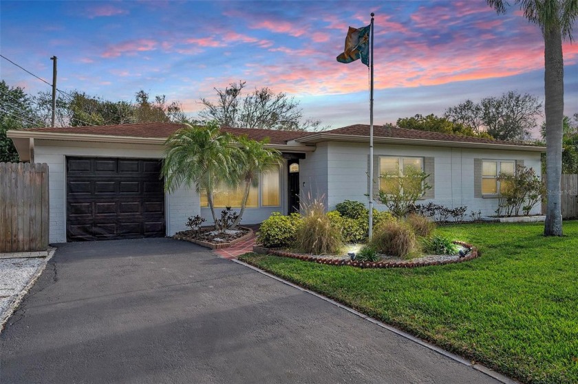 Welcome to this MOVE IN READY single-family home nestled on a - Beach Home for sale in Clearwater, Florida on Beachhouse.com