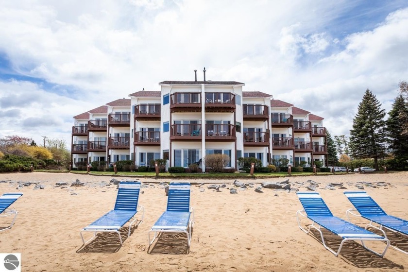 Nestled on the coveted *Miracle Mile* beach, this fully - Beach Condo for sale in Traverse City, Michigan on Beachhouse.com