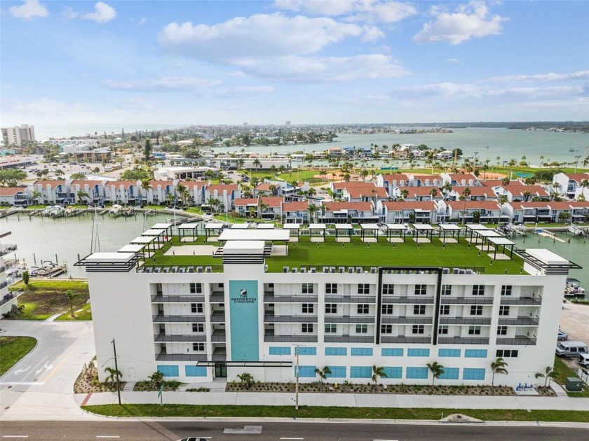 Discover unparalleled beach living in this exquisite new - Beach Condo for sale in Madeira Beach, Florida on Beachhouse.com