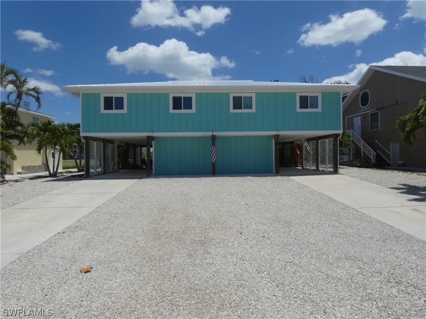 RARE WATER FRONT WEEKLY RENTAL!!, THIS DUPLEX IS LOCATED ON A - Beach Home for sale in Fort Myers Beach, Florida on Beachhouse.com