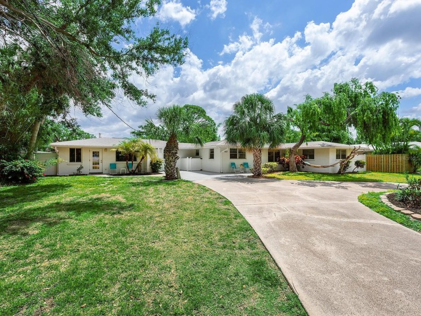 Beneath swaying palms and a weeping bottlebrush tree on a - Beach Home for sale in Nokomis, Florida on Beachhouse.com