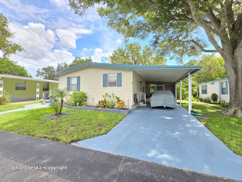 Welcome to this charming 1983 double-wide mobile home, nestled - Beach Home for sale in Largo, Florida on Beachhouse.com