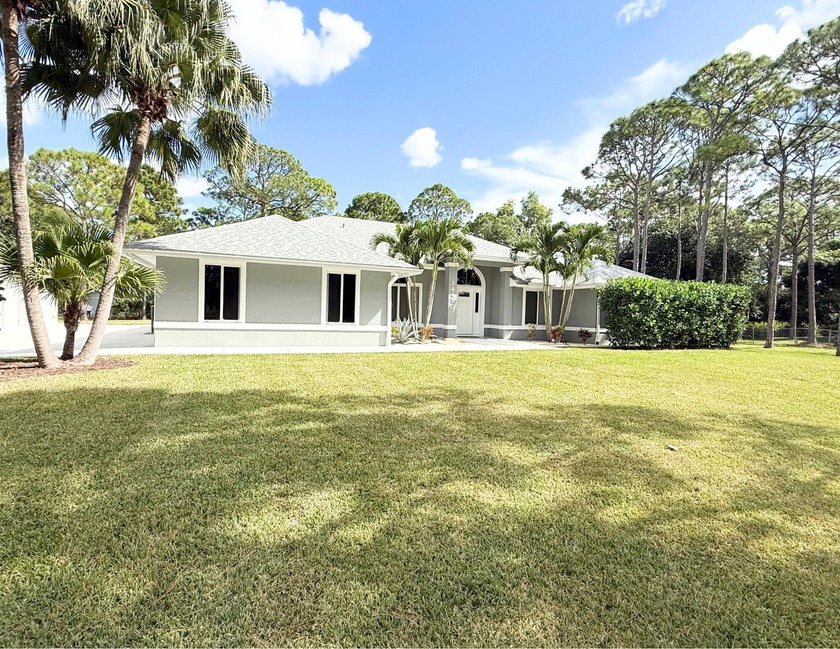 NEW LOOK, NEW FACE, AND PRICED TO SELL!Zoned for Top Rated - Beach Home for sale in Palm Beach Gardens, Florida on Beachhouse.com