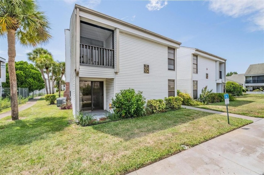 Discover this charming GROUND FLOOR corner unit condo in the - Beach Condo for sale in Tarpon Springs, Florida on Beachhouse.com