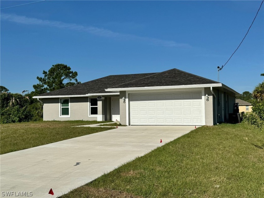 Beautiful, canal front, 3 bedrooms, 2 bathrooms, 2 car garage - Beach Home for sale in Lehigh Acres, Florida on Beachhouse.com