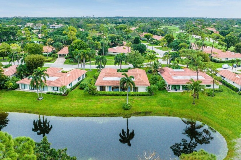 Nestled within lush landscaping and peaceful water views, this - Beach Home for sale in Boynton Beach, Florida on Beachhouse.com