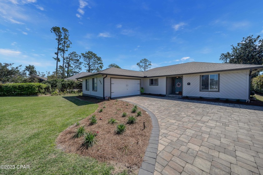 This property is situated on a quiet cul-de-sac on large lot in - Beach Home for sale in Panama City Beach, Florida on Beachhouse.com