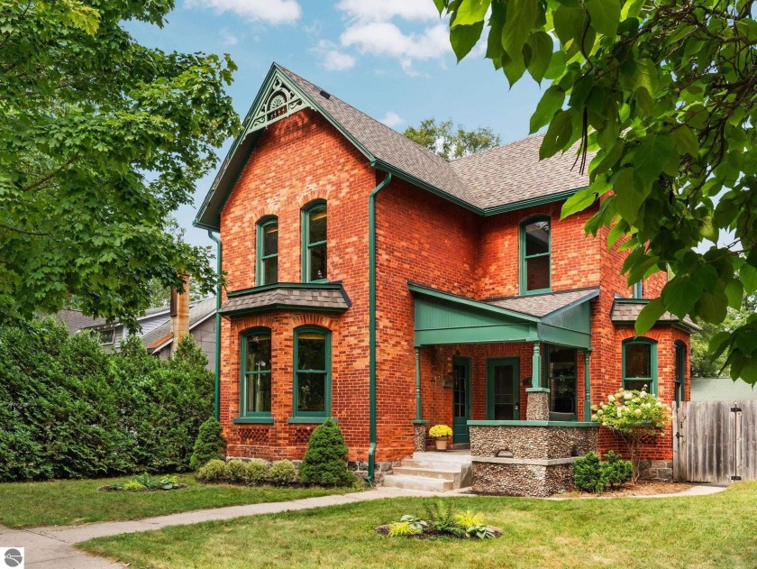 Historic charm meets thoughtful modern living in this beloved - Beach Home for sale in Traverse City, Michigan on Beachhouse.com