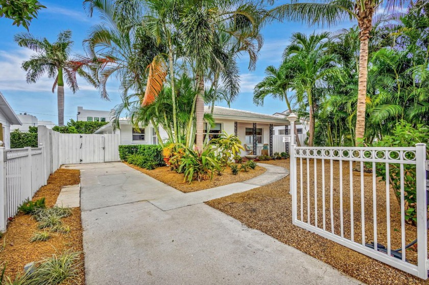 Enjoy coastal living from this stunning pool home nestled in the - Beach Home for sale in West Palm Beach, Florida on Beachhouse.com