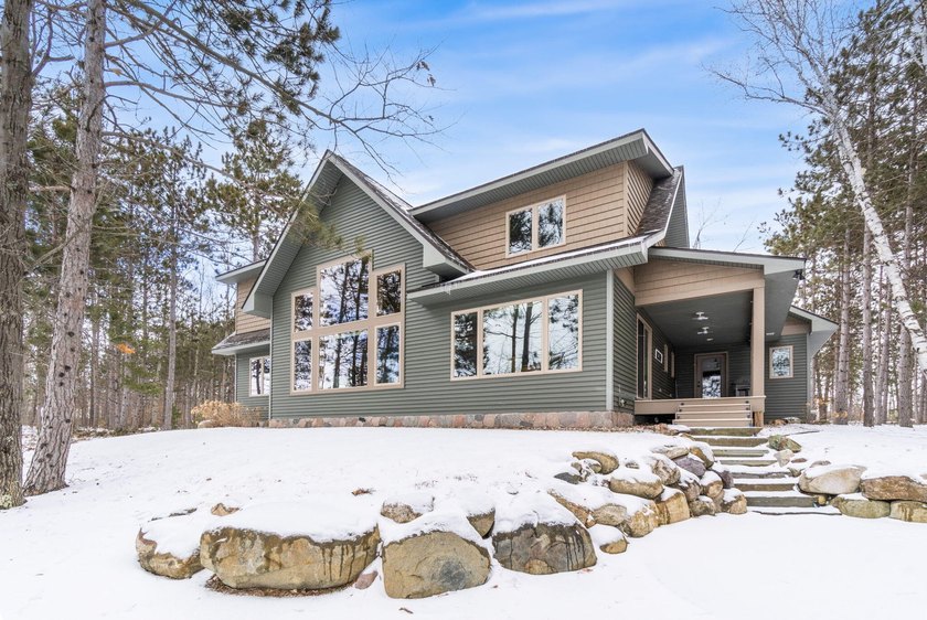 From the moment you enter, stunning lake views become part of - Beach Home for sale in Cheboygan, Michigan on Beachhouse.com