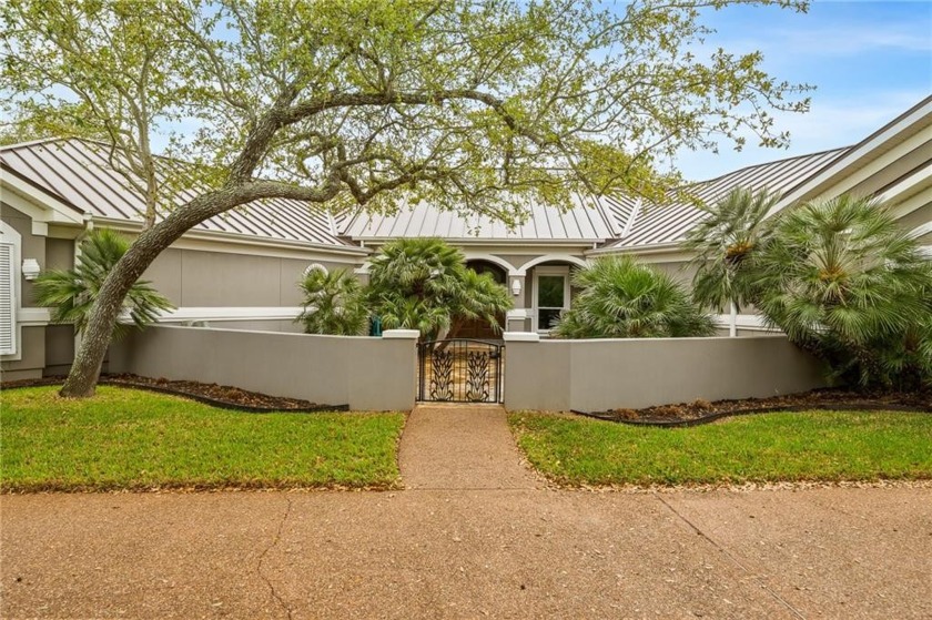 Enter through the beautifully landscaped courtyard and feel the - Beach Home for sale in Rockport, Texas on Beachhouse.com