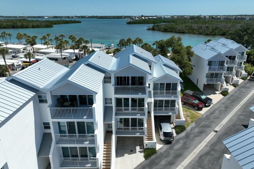 Coastal Paradise Awaits: Ocean and Bay Views Galore! Experience - Beach Condo for sale in Englewood, Florida on Beachhouse.com