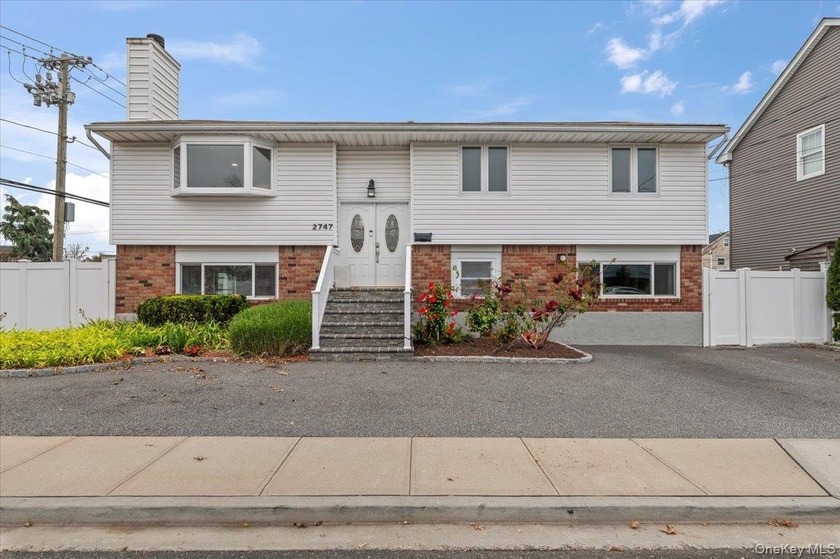Welcome to this spacious and beautifully updated Hi-Ranch - Beach Home for sale in Bellmore, New York on Beachhouse.com