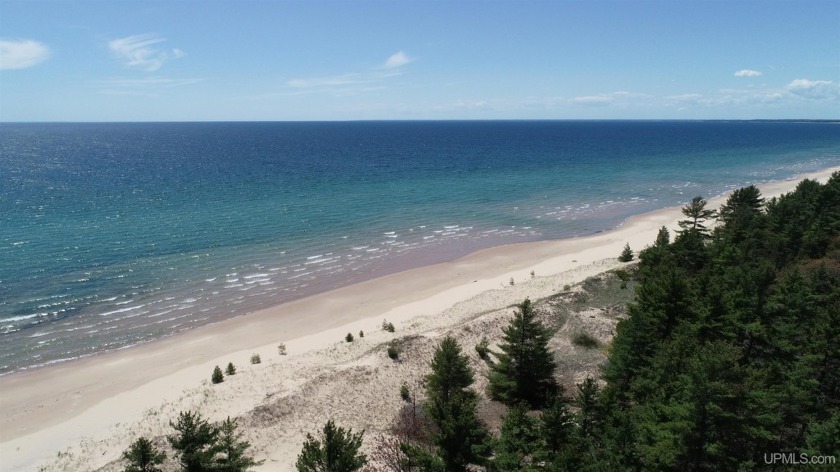 Nestled along the shimmering shores of Lake Michigan, this - Beach Acreage for sale in Gulliver, Michigan on Beachhouse.com