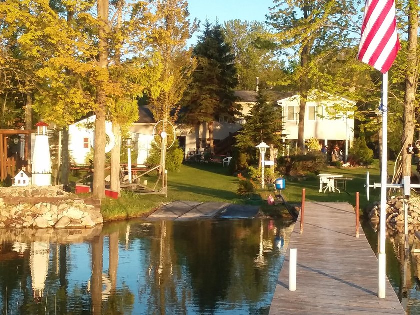 Enjoy waterfront living in this charming three bedroom, one and - Beach Home for sale in Alpena, Michigan on Beachhouse.com