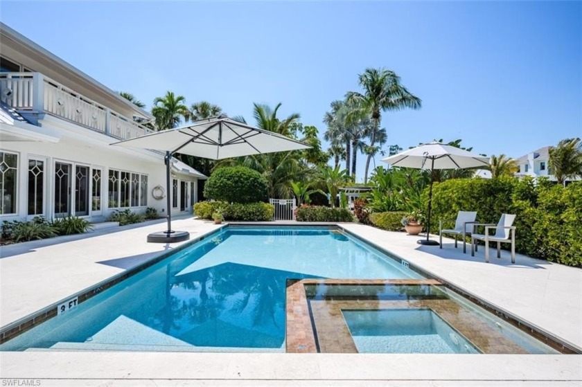 Welcome to your dream home in prestigious Aqualane Shores, where - Beach Home for sale in Naples, Florida on Beachhouse.com