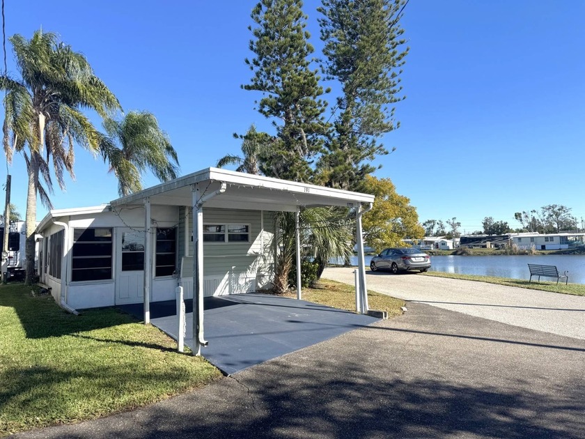 This Charming Lakefront Corner Lot, 1 Bedroom, 1 Bath Fully - Beach Home for sale in Holiday, Florida on Beachhouse.com