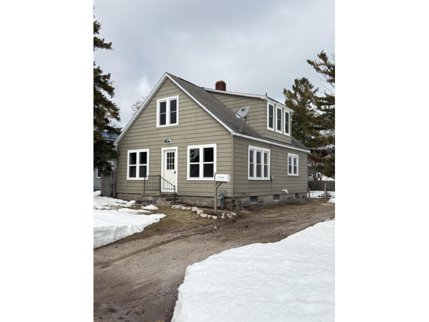 This beautifully renovated 4-bedroom, 1-bath home combines - Beach Home for sale in Rogers City, Michigan on Beachhouse.com