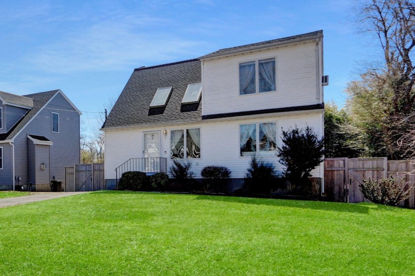Welcome to 18 Saint George Dr.! This Lovely expanded cape is - Beach Home for sale in Shirley, New York on Beachhouse.com