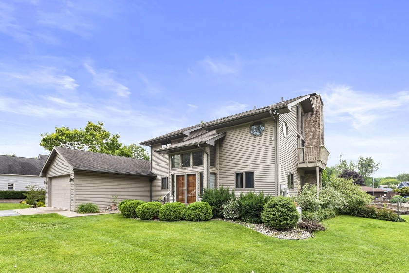 Discover the charm of this stunning waterfront home on Paw Paw - Beach Home for sale in Coloma, Michigan on Beachhouse.com