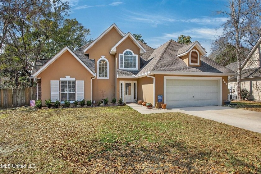 Tucked beneath a canopy of towering oaks and fragrant magnolias - Beach Home for sale in Ocean Springs, Mississippi on Beachhouse.com