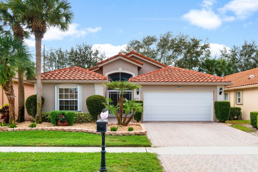 Located on a prime private lot in the charming gated community - Beach Home for sale in Boynton Beach, Florida on Beachhouse.com