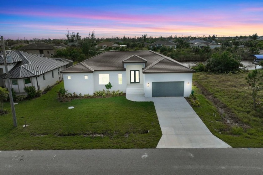 Discover this stunning new 3-bedroom, 3.5-bathroom residence - Beach Home for sale in Port Charlotte, Florida on Beachhouse.com