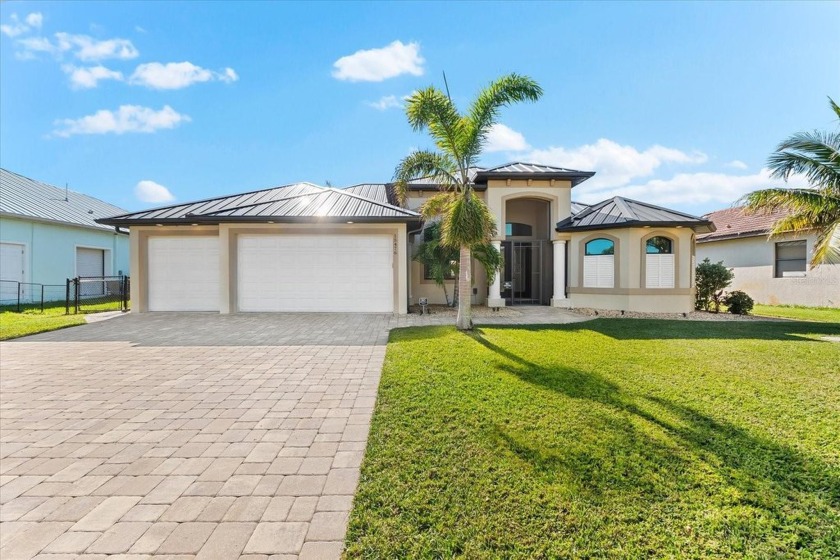 Welcome to this stunning 3-bedroom, 2-bathroom home with a den - Beach Home for sale in Port Charlotte, Florida on Beachhouse.com