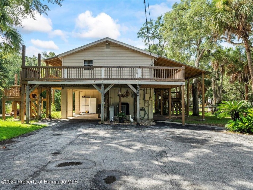 Nestled on a picturesque acre of land along a serene split canal - Beach Home for sale in Homosassa, Florida on Beachhouse.com