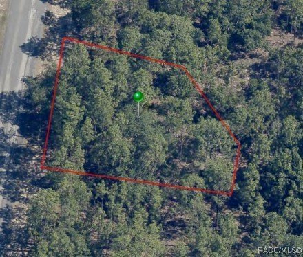 This 0.26-acre wooded lot in the sought-after Sugarmill Woods - Beach Lot for sale in Homosassa, Florida on Beachhouse.com