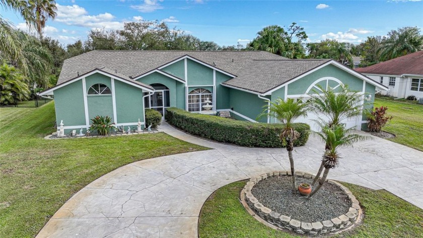 This inviting three-bedroom, two-bath waterfront pool home in - Beach Home for sale in Port Charlotte, Florida on Beachhouse.com