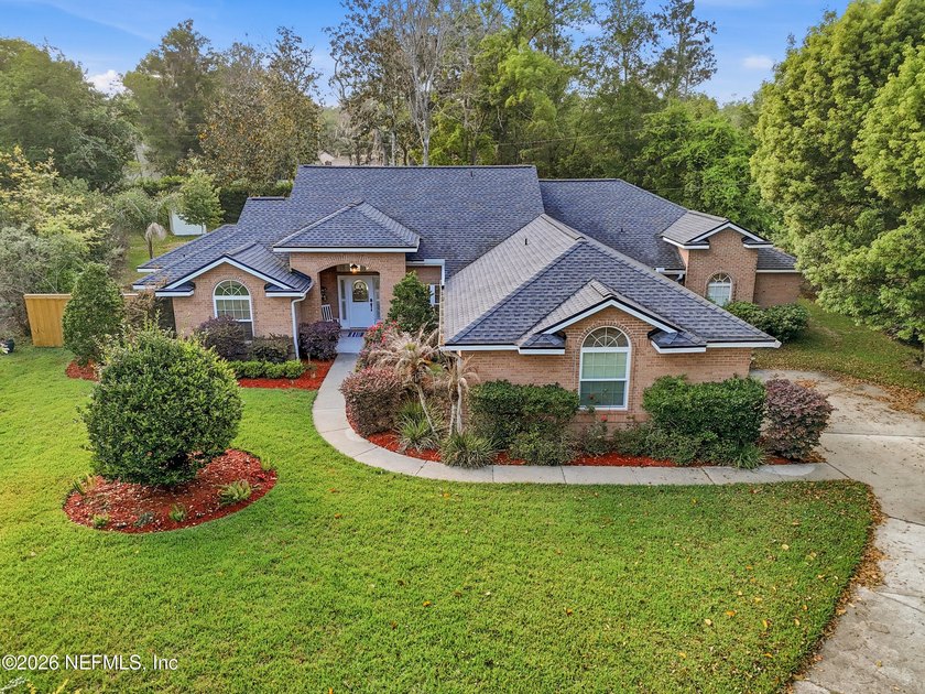 From the moment you arrive gorgeous oak trees lining both sides - Beach Home for sale in Fleming Island, Florida on Beachhouse.com