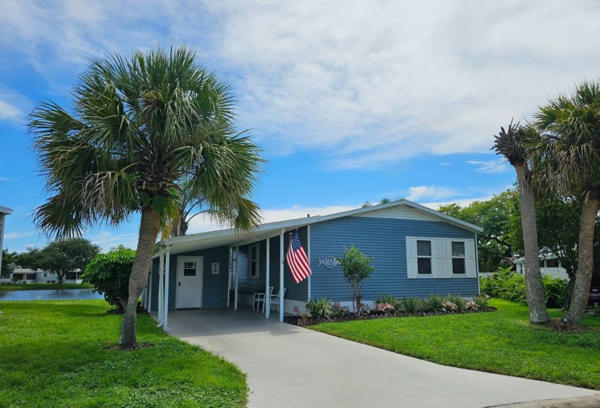 This amazing water view home in the 55+ Resort Style Community - Beach Home for sale in Vero Beach, Florida on Beachhouse.com