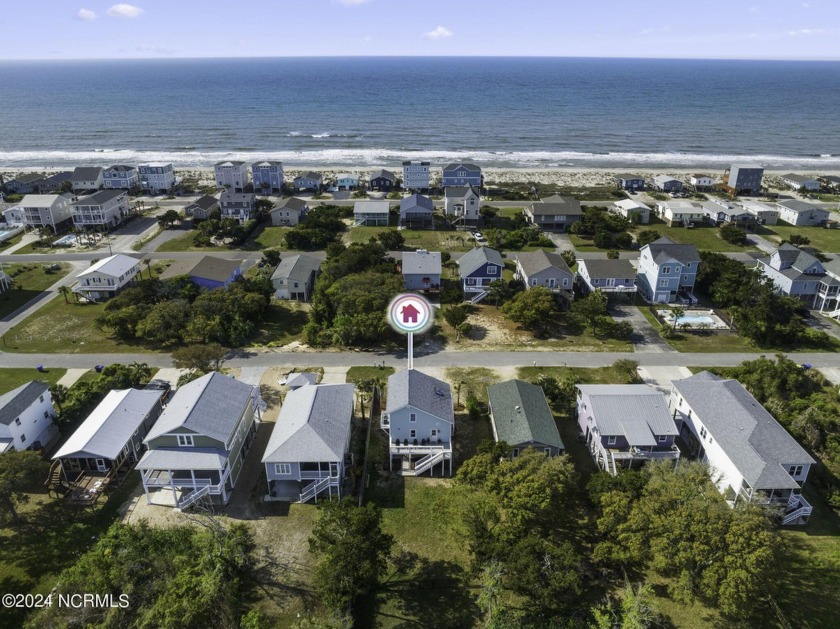 Discover the feeling of coastal living without breaking the - Beach Home for sale in Oak Island, North Carolina on Beachhouse.com