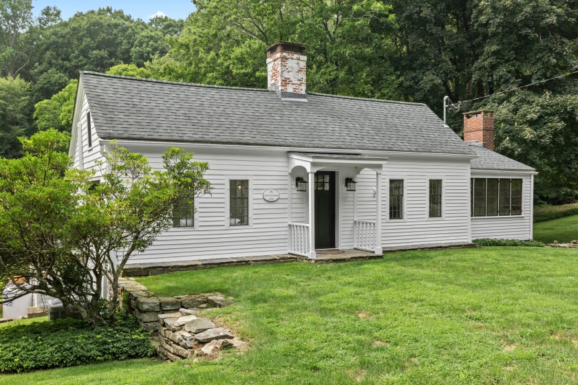 Nestled into the landscape surrounded by streams and forest sits - Beach Home for sale in Essex, Connecticut on Beachhouse.com