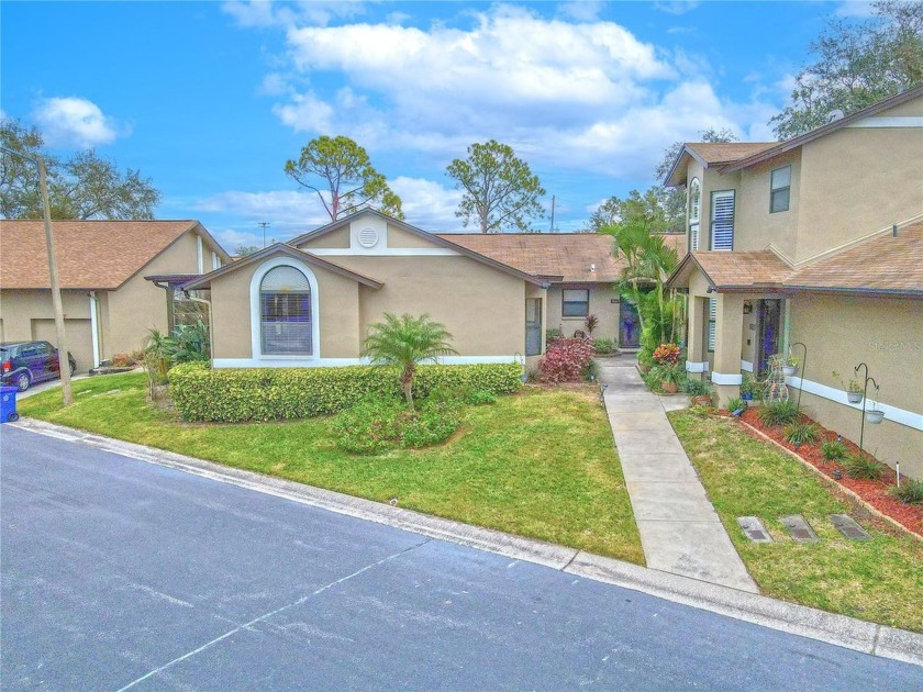 As you step under the covered front entrance, you'll notice the - Beach Home for sale in Dunedin, Florida on Beachhouse.com