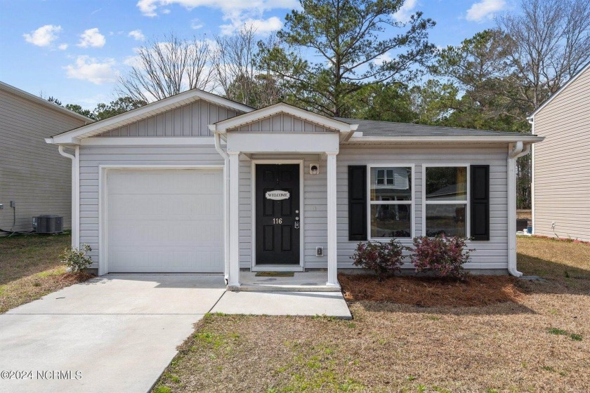 Welcome to this meticulously maintained home featuring an open - Beach Home for sale in Sunset Beach, North Carolina on Beachhouse.com